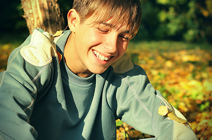 Happy teen changing at a therapeutic program for troubled youth