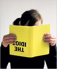 Unprepared girl reading upside-down