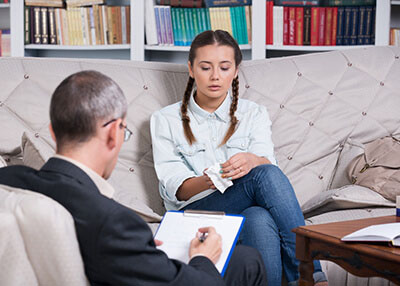 Therapy Insider - Sad adolescent girl in rehabilitation from addiction at therapeutic facility for youth