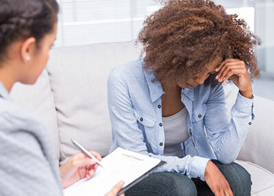 Therapy Insider - Depressed adolescent girl in rehabilitation from substance abuse at therapeutic facility for youth