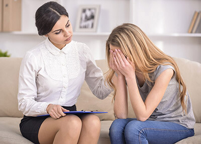 Therapy Insider - Depressed teen girl rehabilitating from addiction at therapeutic facility for youth