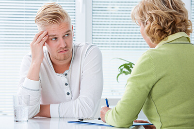 Therapy Insider - Young male in counseling session