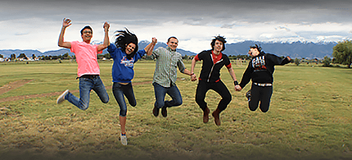 Teens jumping together