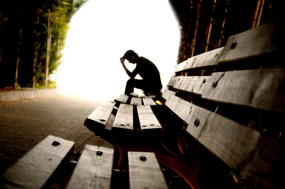 Depressed athlete on bench