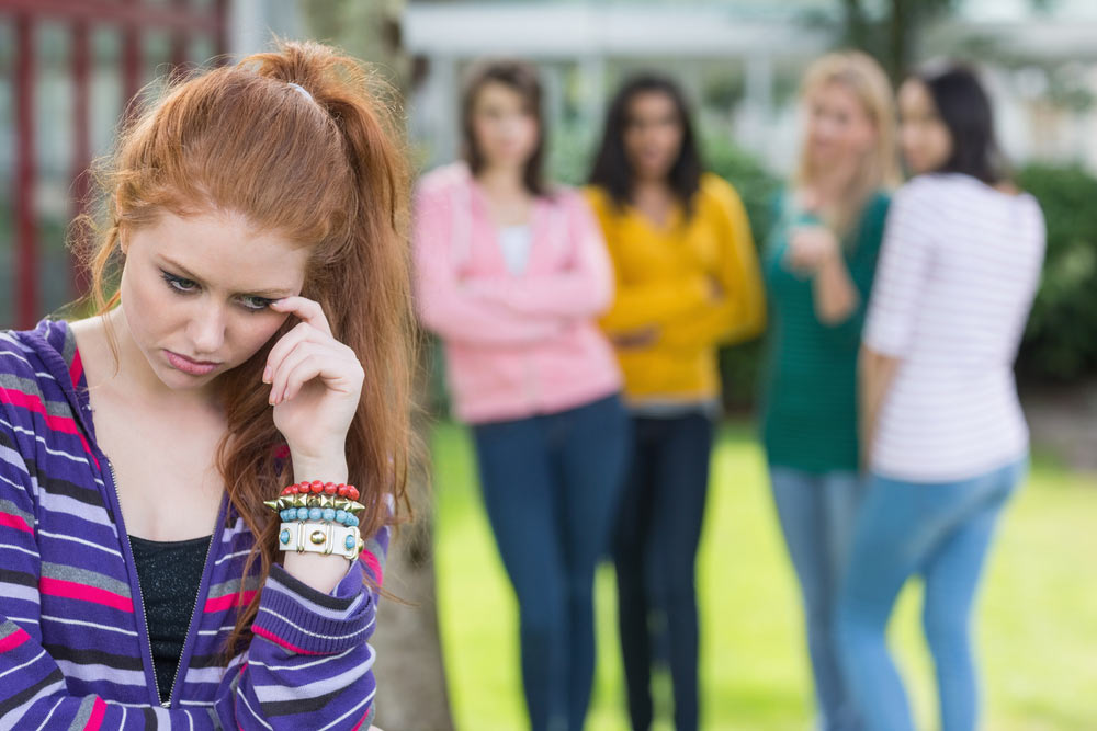 Girl being bullied by friends