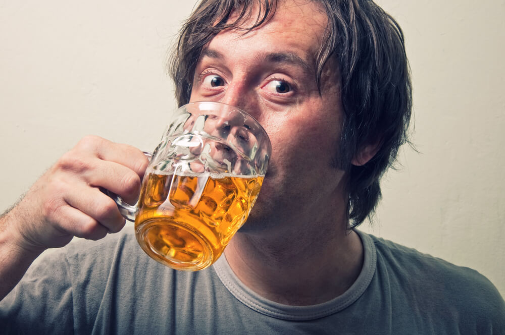 sweaty man drinking beer